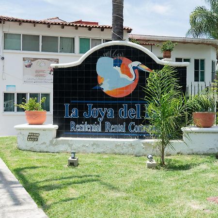 Capital O La Joya Del Lago Ахихик Экстерьер фото